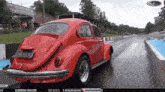a red car with a license plate that says cnv5530