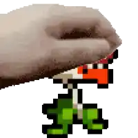a pixel art of a hand holding a mushroom with the letter t on it