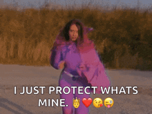 a woman in a purple sweater says i just protect what 's mine