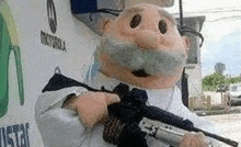 a stuffed animal with a beard and mustache is holding a rifle .