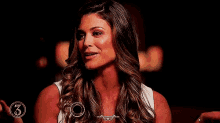 eve torres is a former divas champion with her arms outstretched and her eyes closed .