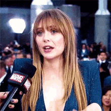 Elizabeth Olsen Interview GIF - Elizabeth Olsen Interview Marvel GIFs