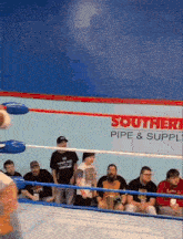 a wrestling ring with a sign that says southern pipe and supply
