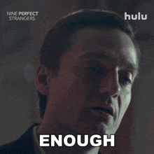 a man in a suit says enough in a hulu advertisement