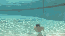 a man is swimming underwater in a pool with failarmy written on the bottom of the screen