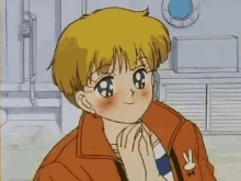 a girl with short blonde hair and blue eyes is wearing an orange jacket .