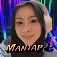 a woman wearing headphones is giving a thumbs up and the word mantap is behind her