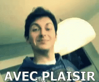 a man is smiling with the words avec plaisir written above him