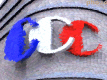 a blue white and red cc logo on a gray background
