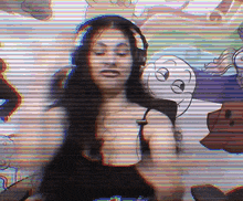 a woman wearing headphones is dancing in front of a cartoon character