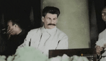 a black and white photo of a man with a mustache and the words smithsonian on the bottom right