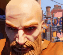 a bald man with a beard is looking at the camera .