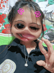 a girl wearing a black shirt with a badge on it that says ' a.c.o. ' on it