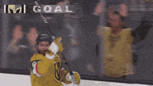 a hockey player with the number 6 on his jersey celebrates
