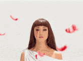 a woman with blood running down her face is wearing a white top
