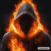 a man in a hoodie is surrounded by flames and the letters shedevrum are below him