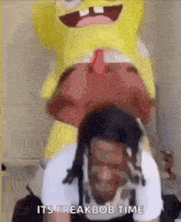 a man is riding on the back of a spongebob squarepants mascot .