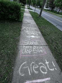 a sidewalk has chalk written on it that says " great "