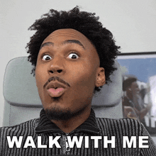 a man with a surprised look on his face and the words walk with me behind him