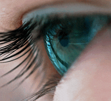 a close up of a person 's blue eye