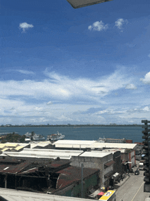 an aerial view of a city with a large body of water