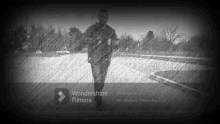 a black and white photo of a man walking with wondershare filmora written on the bottom