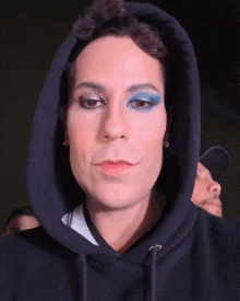 a close up of a person wearing a hoodie