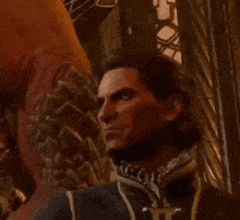 a man is sitting in front of a dragon in a video game and looking at the camera .