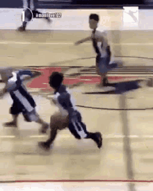 a basketball game is being played on a court with the number 102 on the bottom of the screen