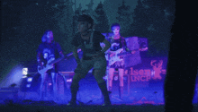 a group of people on stage with a sign that says lncf