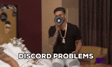a man holding a megaphone with the words discord problems behind him