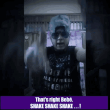 a man wearing sunglasses and a hat says that 's right bebe shake shake shake !