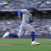 a baseball player for the new york mets is running across the field