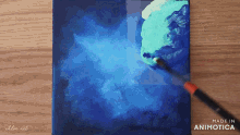 a painting is being painted with a brush and the words made in animatica are visible