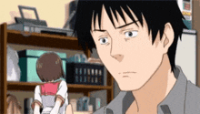 a man is looking at a girl in a school uniform