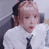a girl with pink hair is wearing a white shirt and tie with a black bow in her hair