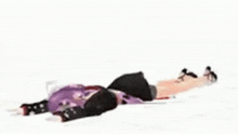 a 3d anime girl is laying on the floor with a knife in her hand .