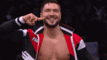 a wrestler wearing a red and black jacket with the word pad on it