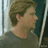 a close up of a man 's face with the netflix logo visible
