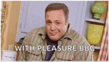 a man in a plaid shirt is smiling with the words with pleasure bbc behind him