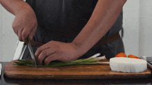 Slicing Green Onion Two Plaid Aprons GIF