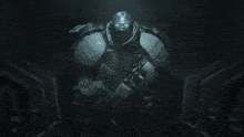 a soldier in a gas mask holds a gun in a dark room