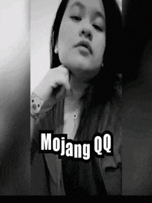 a black and white photo of a woman with the words mojang qq on the bottom