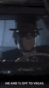 a man in a hat and sunglasses says hit it