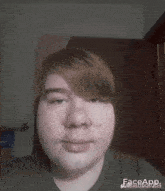 a close up of a person 's face with the word face app on the bottom