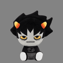 a stuffed toy with a black shirt with the number 9 on it