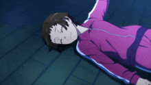 a girl in a pink jacket is laying on the floor with her eyes closed