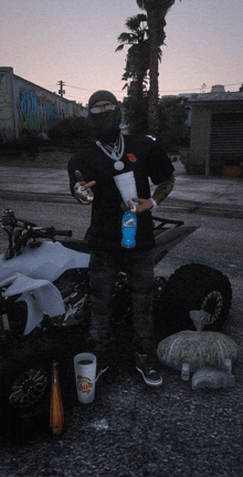 a man standing next to a motorcycle holding a can of doritos chips