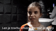 a young girl is talking into a microphone with the words len je trochu smutny ale inac je dobry written below her
