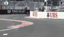 a race track with a ubs sign on the side